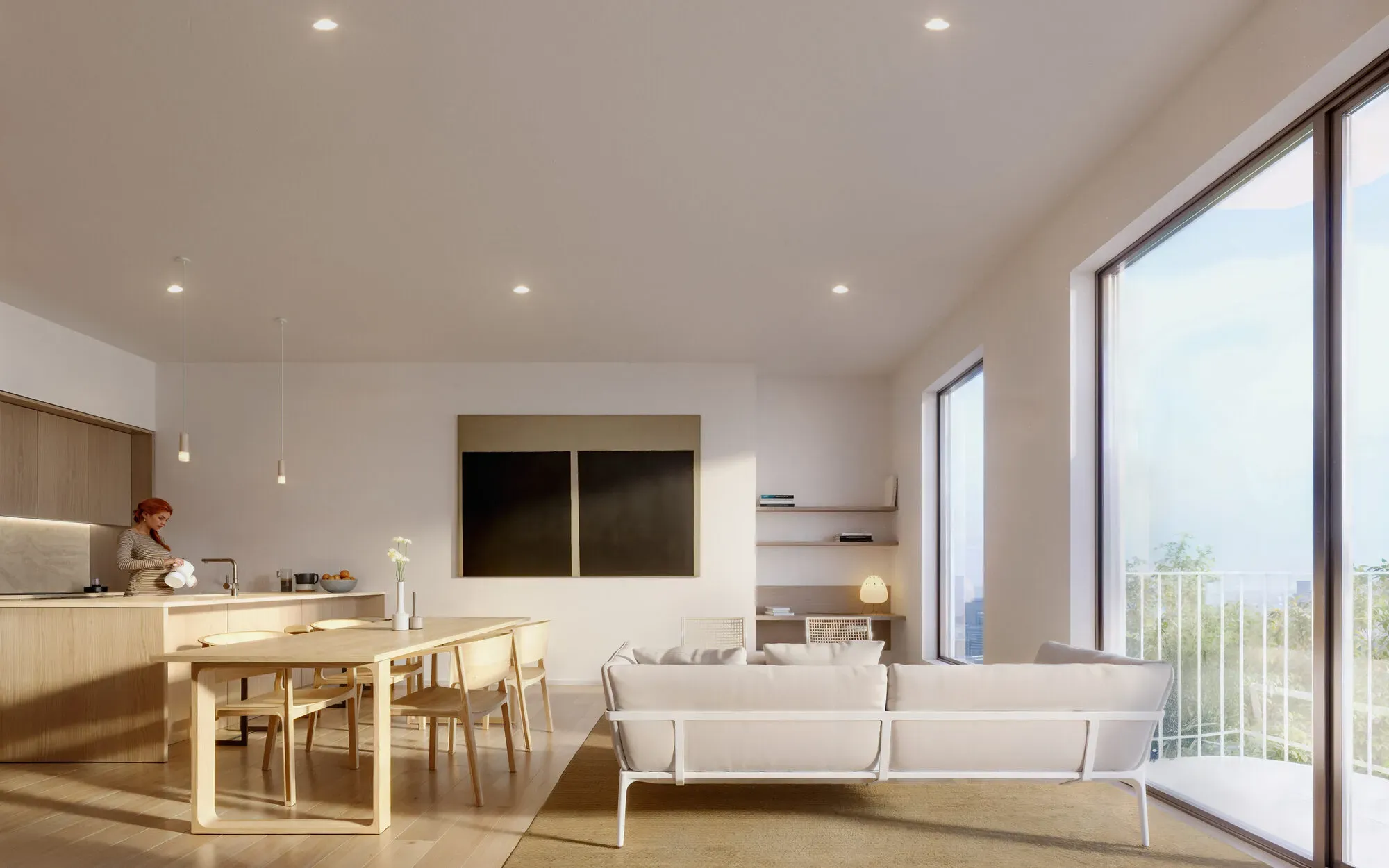 Modern open-plan apartment with wooden kitchen, dining area, white sofa, and large windows overlooking cityscape