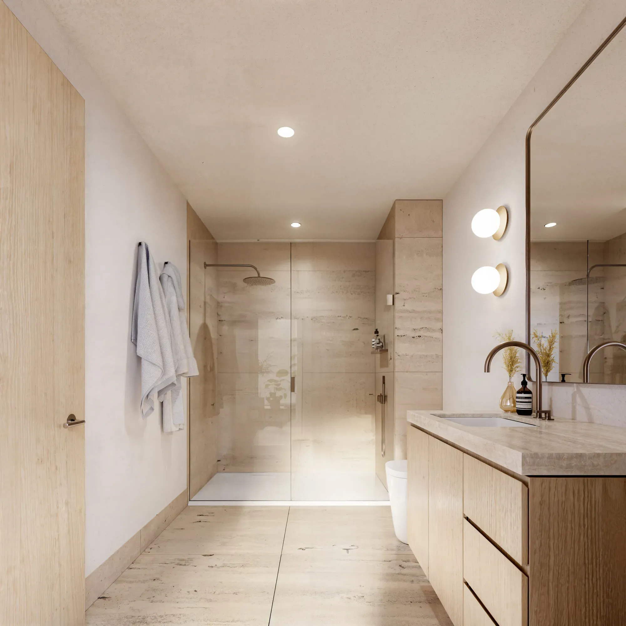 Modern bathroom with light wood cabinetry, marble countertops, glass shower enclosure, and dual vanity sinks.