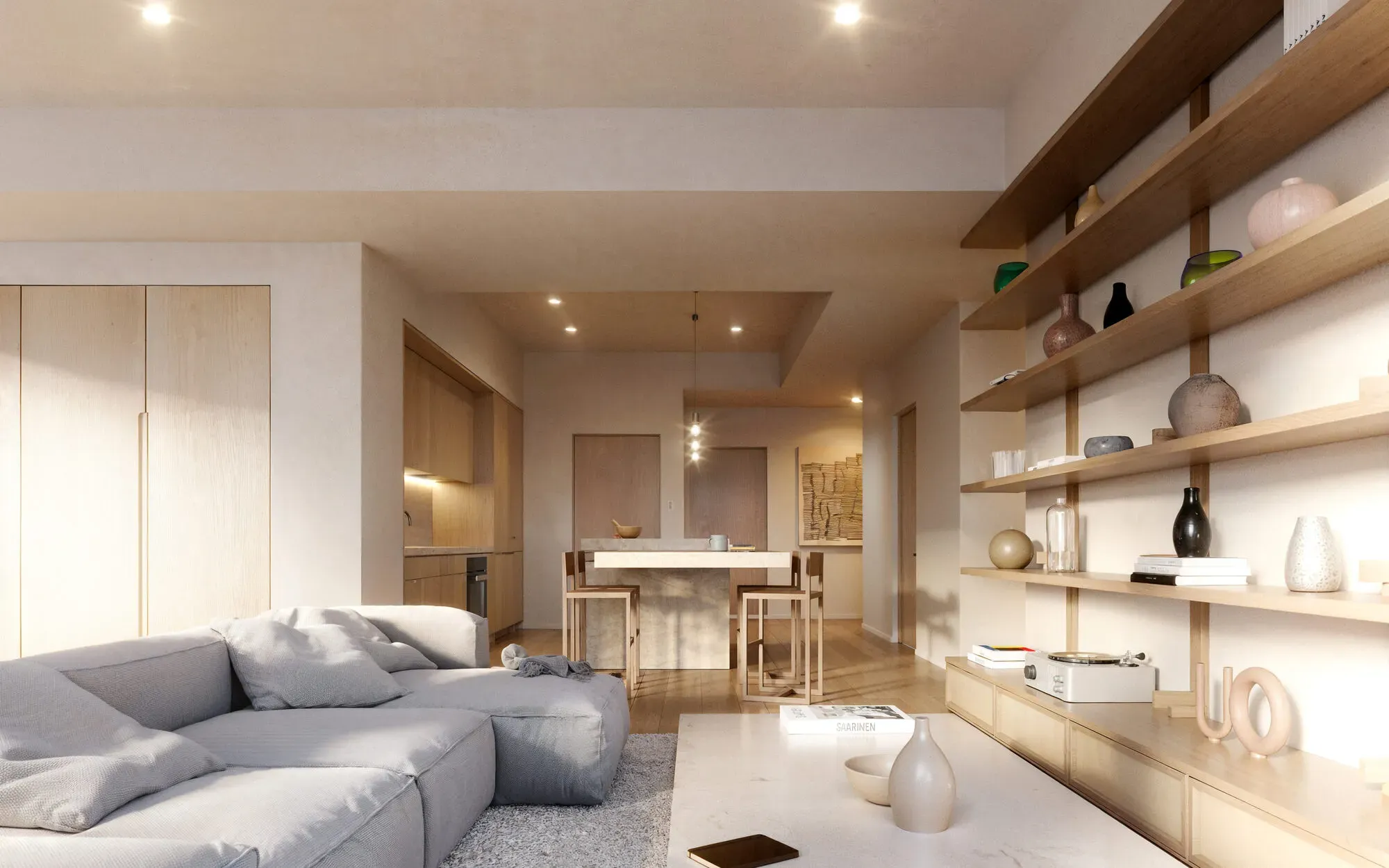 Modern studio apartment with gray sofa, wooden shelving, kitchen area, and contemporary lighting fixtures.